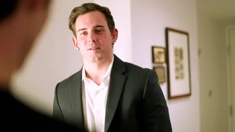 Businessman and Young Man in the Hotel Room